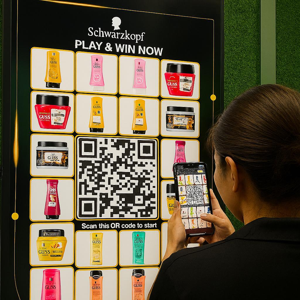 Guest playing Scan & Win interactive game by scanning QR code at a mall activation event in Dubai, with live name display and prize reveal on a big screen.